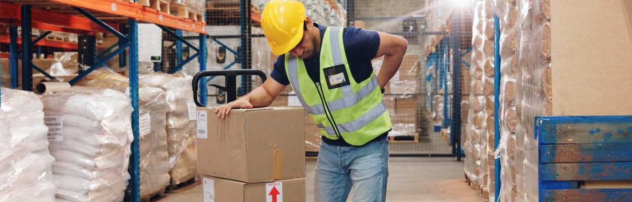 Worker holding their back