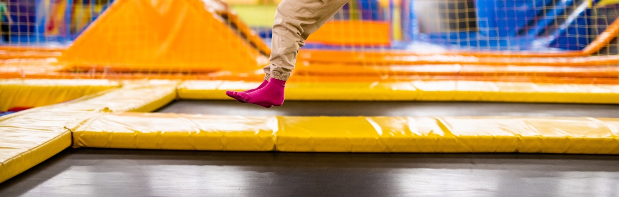 Child jumping on trampoline
