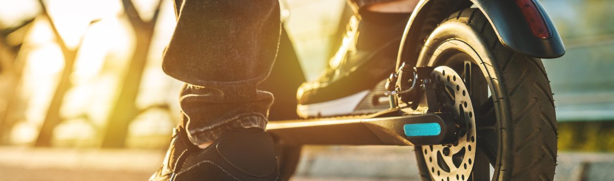 Close up of person on e-scooter